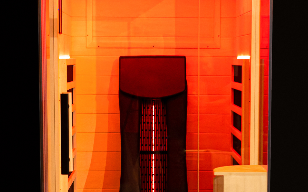 Photographed visible heat-source, timber and glass interface shown only as material context.