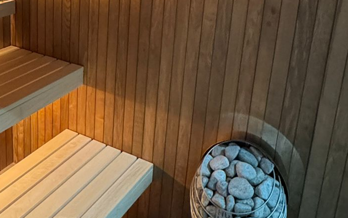 Photographed heater stones, cage and surrounding timber shown only as equipment context.